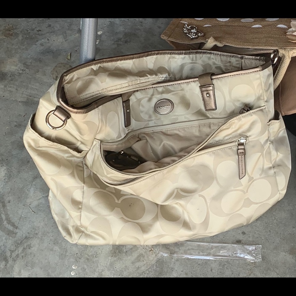 Light tan and brown authentic Coach diaper bag.